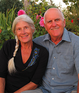 A man and woman pose for the camera.