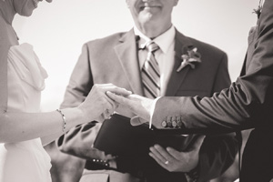 A man in suit and tie holding a book.